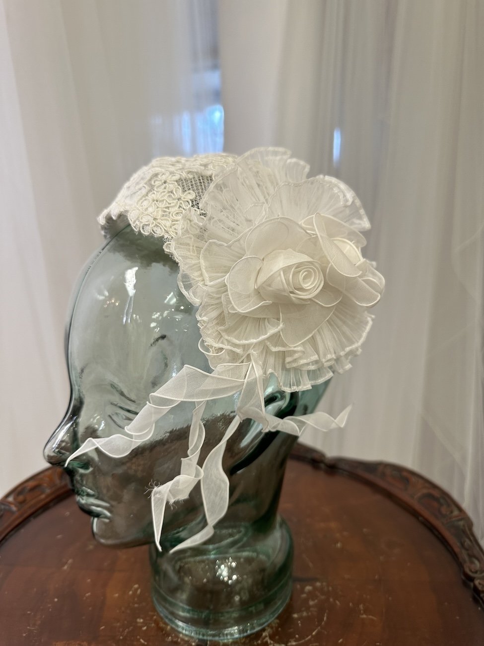 1984 lace bridal cap with large rolled rose and ruffle on the side
