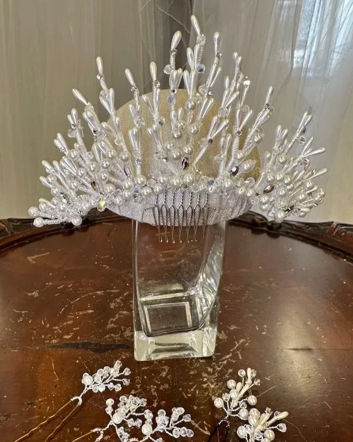 Stunning restyle of a 1992 bridal headpiece with restored pearlized elements and cleaned crystals and rhinestones.