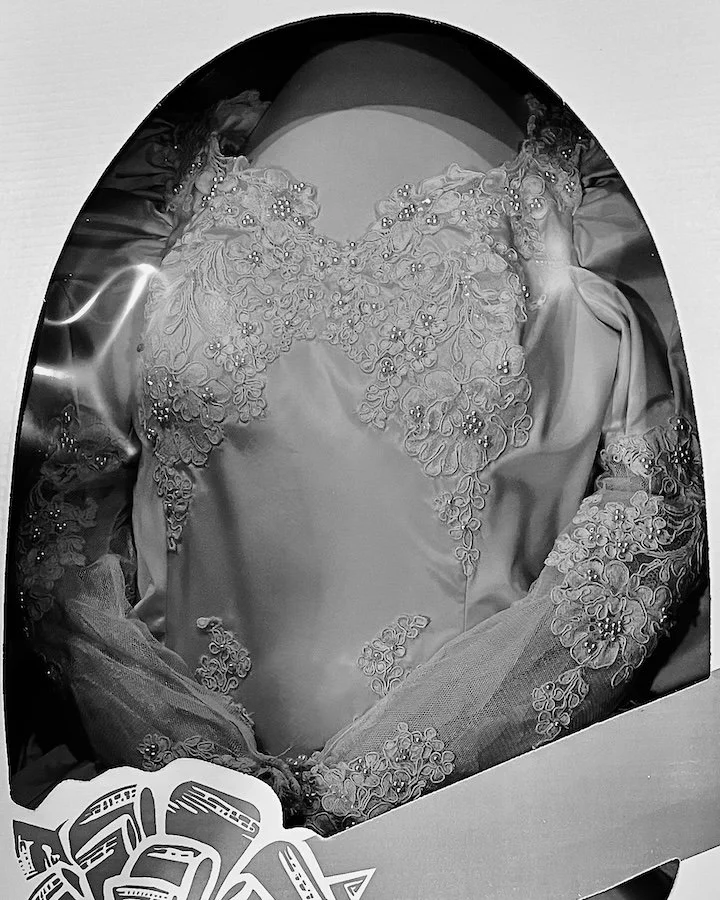 Deceased mom's wedding dress in a preservation box.