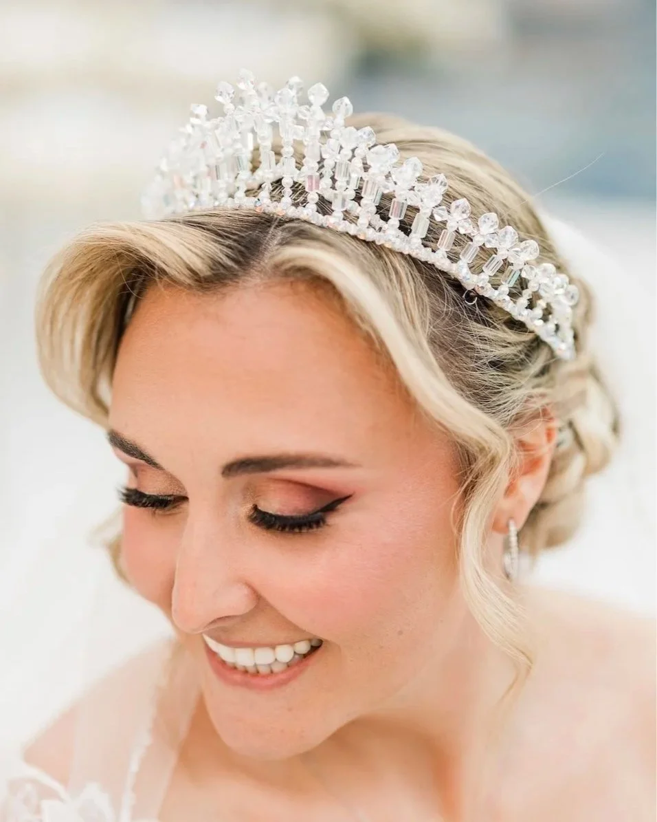 Close up bridal portrait of smiling bride wearing her grandmother's restored crystal wedding crown.