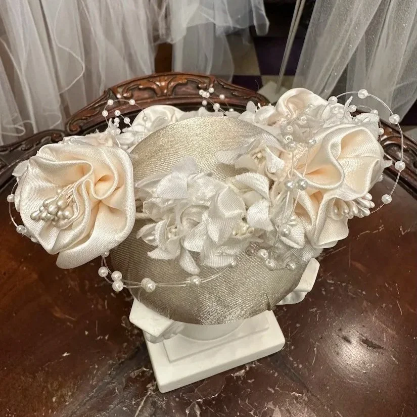 Vintage blush satin flower bun wrap with white flowers and pearls ready to be restyled.