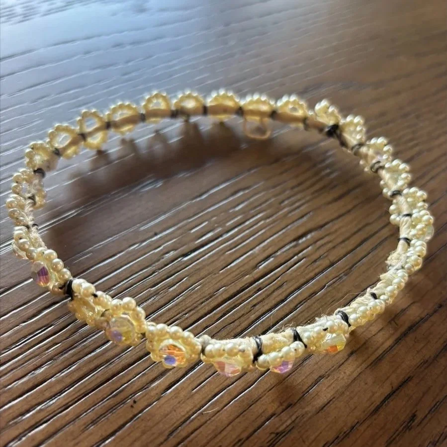 Old wedding crown circular base on a wooden table.