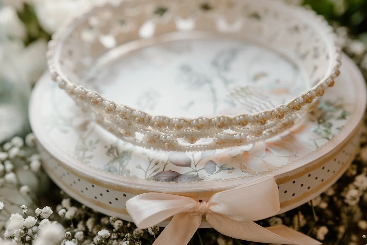 Grandmother's gorgeous restored wedding crown placed on hat box top.