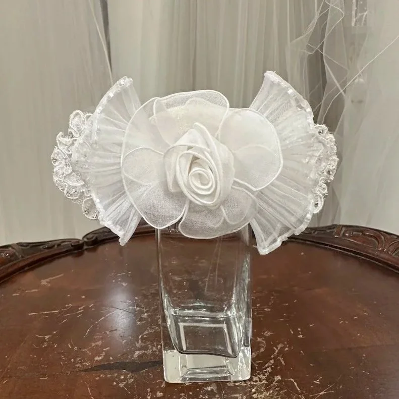 Restyled bridal comb with large rolled flower beaded pleated ruffle and lace pieces on a comb