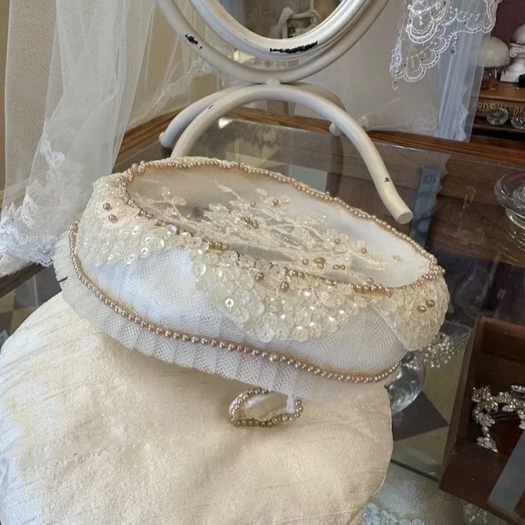 Handmade pearl, lace, and sequin bridal pillbox hat donated to Headpiece.com.