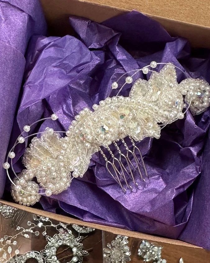 Custom flower girl hair clip in a box with purple tissue paper, made from deceased grandmother's wedding headpiece.