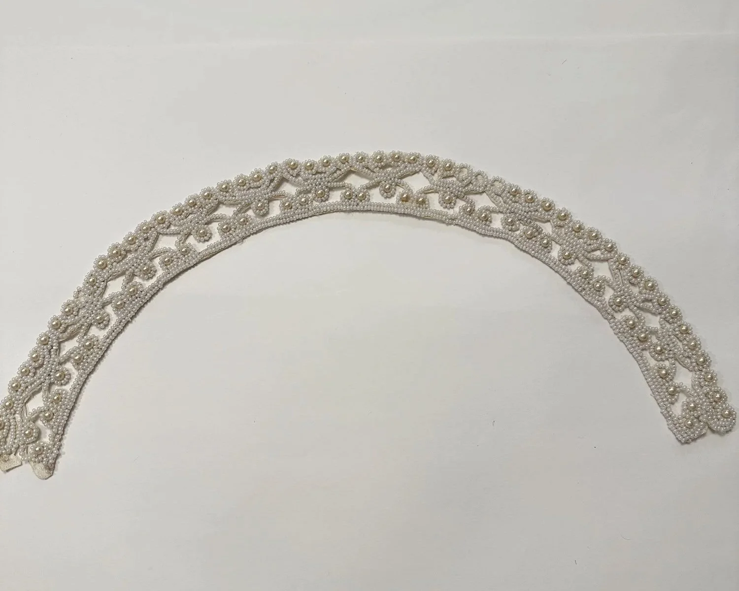 Flat beaded 1950s wedding crown after wire is removed.