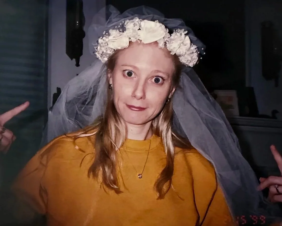 Bride-to-be trying on a 90s floral wreath and pouf style wedding veil.