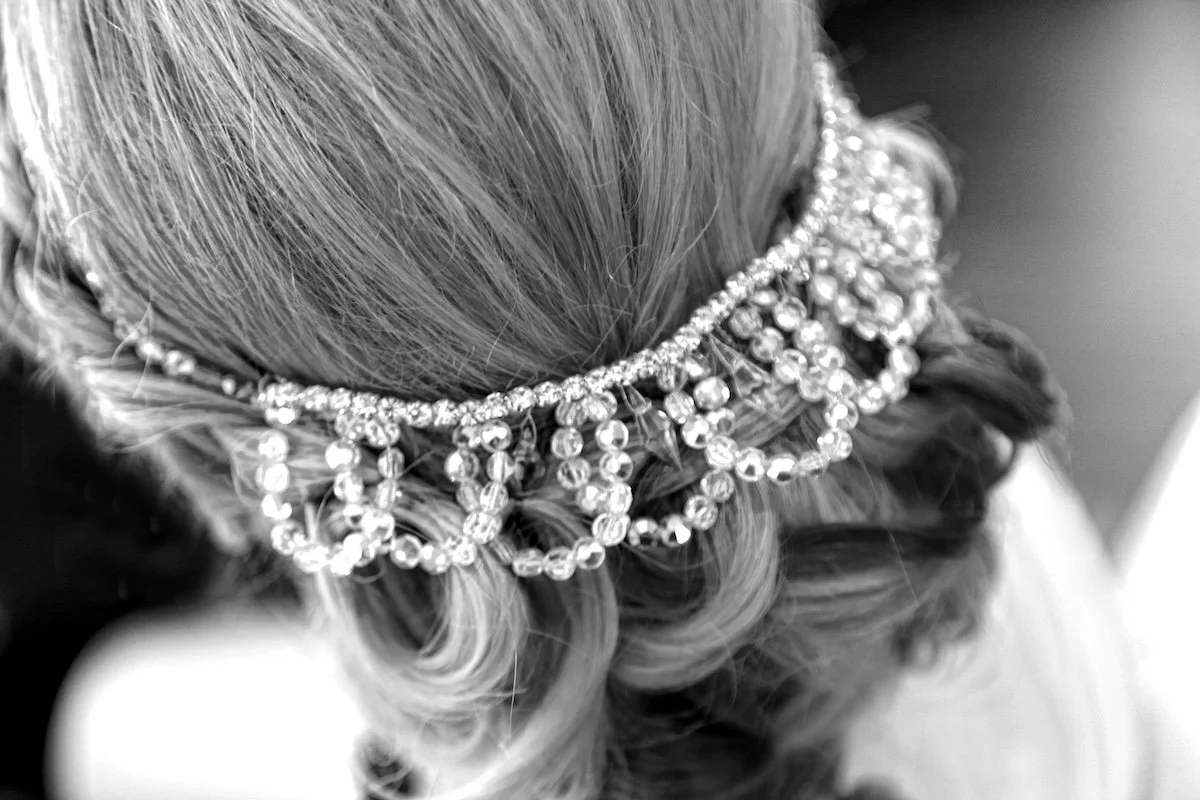 Vintage wedding crown made of AB crystal and rhinestones restyled into a backstyle in brides hair.