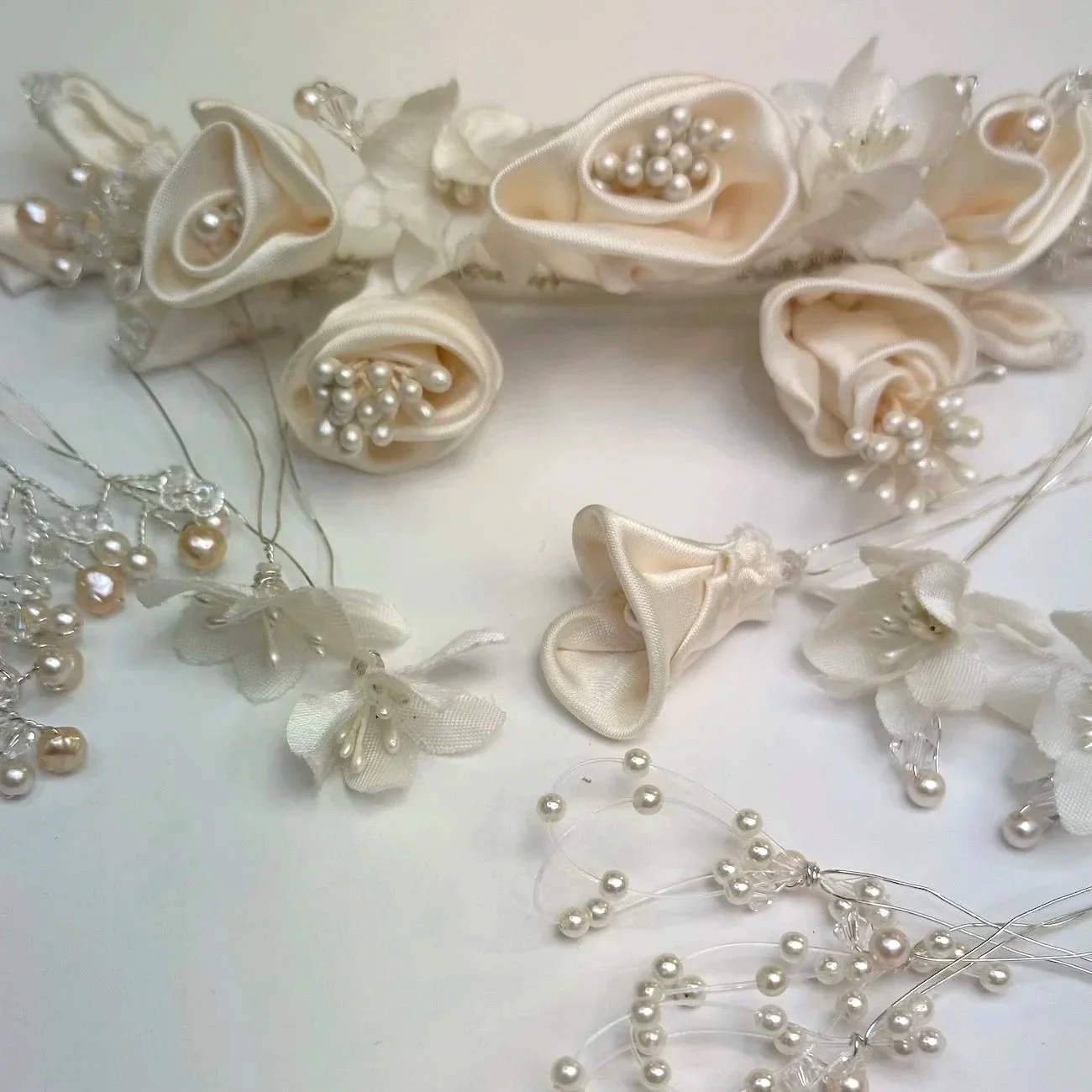 Repurposed mom's 90s headpiece designed with beautiful remade blush satin flowers, crystal and pink pearl accents.