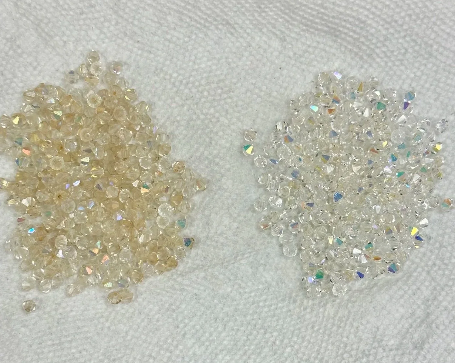 Before and after, pile of dirty vintage Swarovski crystals and hand cleaned crystals.
