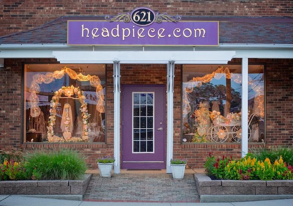 Headpiece.com storefront in Pompton Plains, with signature purple door and purple and gold sign.