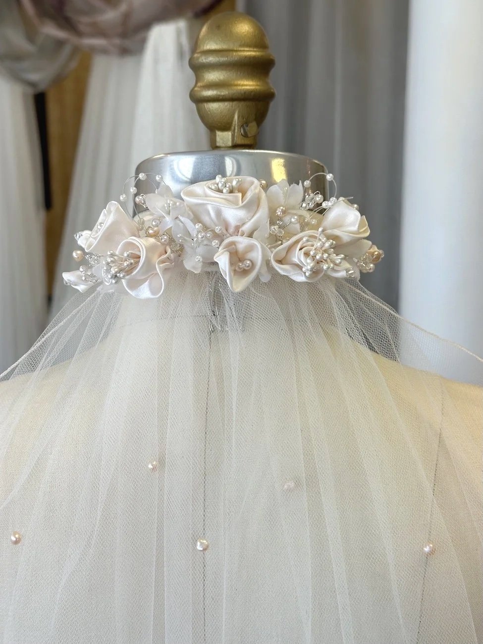Meticulously restored and restyled blush and ivory headpiece and pearl wedding veil.