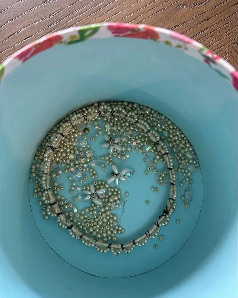 Bowl of beads from dismantled vintage wedding crown ready to be remade.