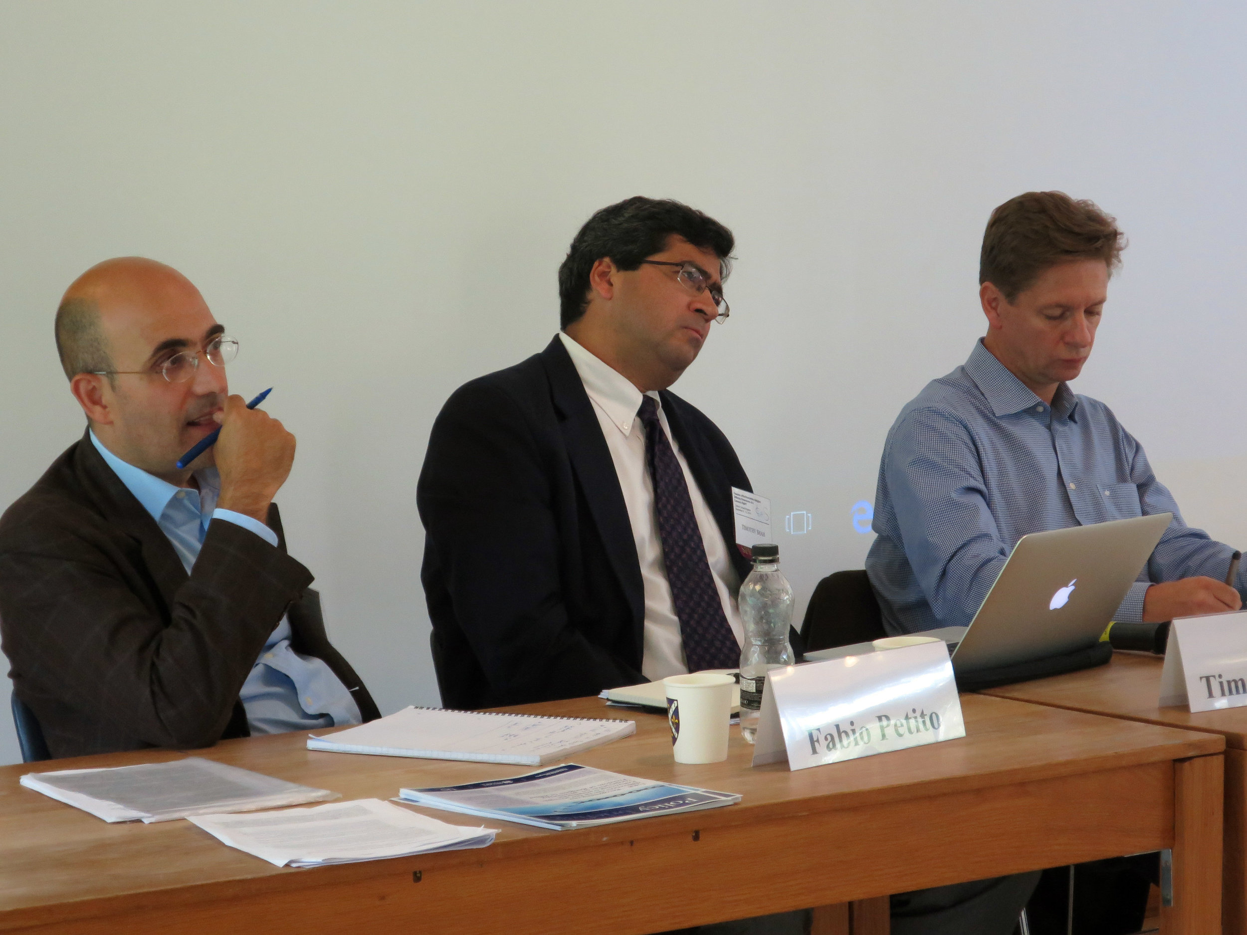  Tim Shah, Senior Advisor, (center) and co-panelists respond to audience questions 