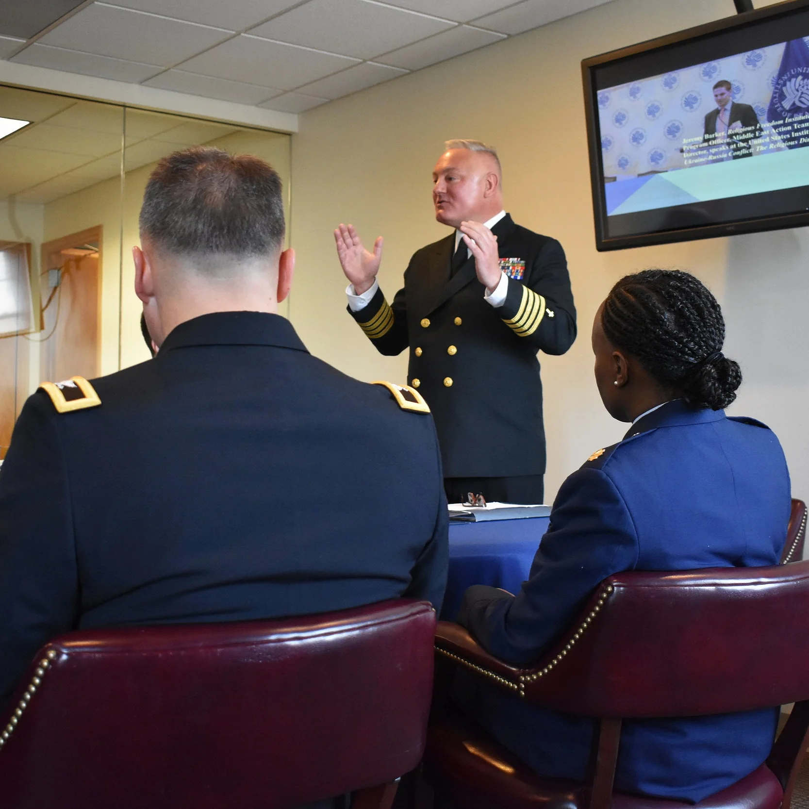 Rev. Daniel L. Mode, CAPT, CHC, USN, Religious Freedom Institute Chaplain Fellow, addresses Chiefs of Chaplains (Army, Navy, and Airforce) and the Ambassador at Large of International Religious Freedom Sam Brownback during a closed door meeting about the intersection between national security and religious freedom.