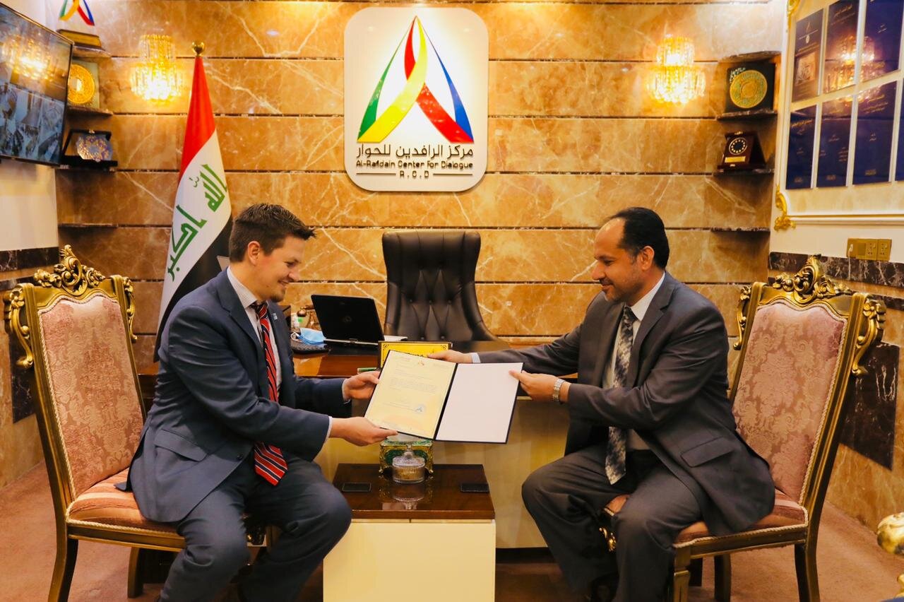 Prof. Dr. Hasan Latif al-Zubaidi, Acting Director, Al-Rafidain Center for Dialogue, presented a letter of appreciation to Jeremy Barker, Director, Middle East Action Team, Religious Freedom Institute.