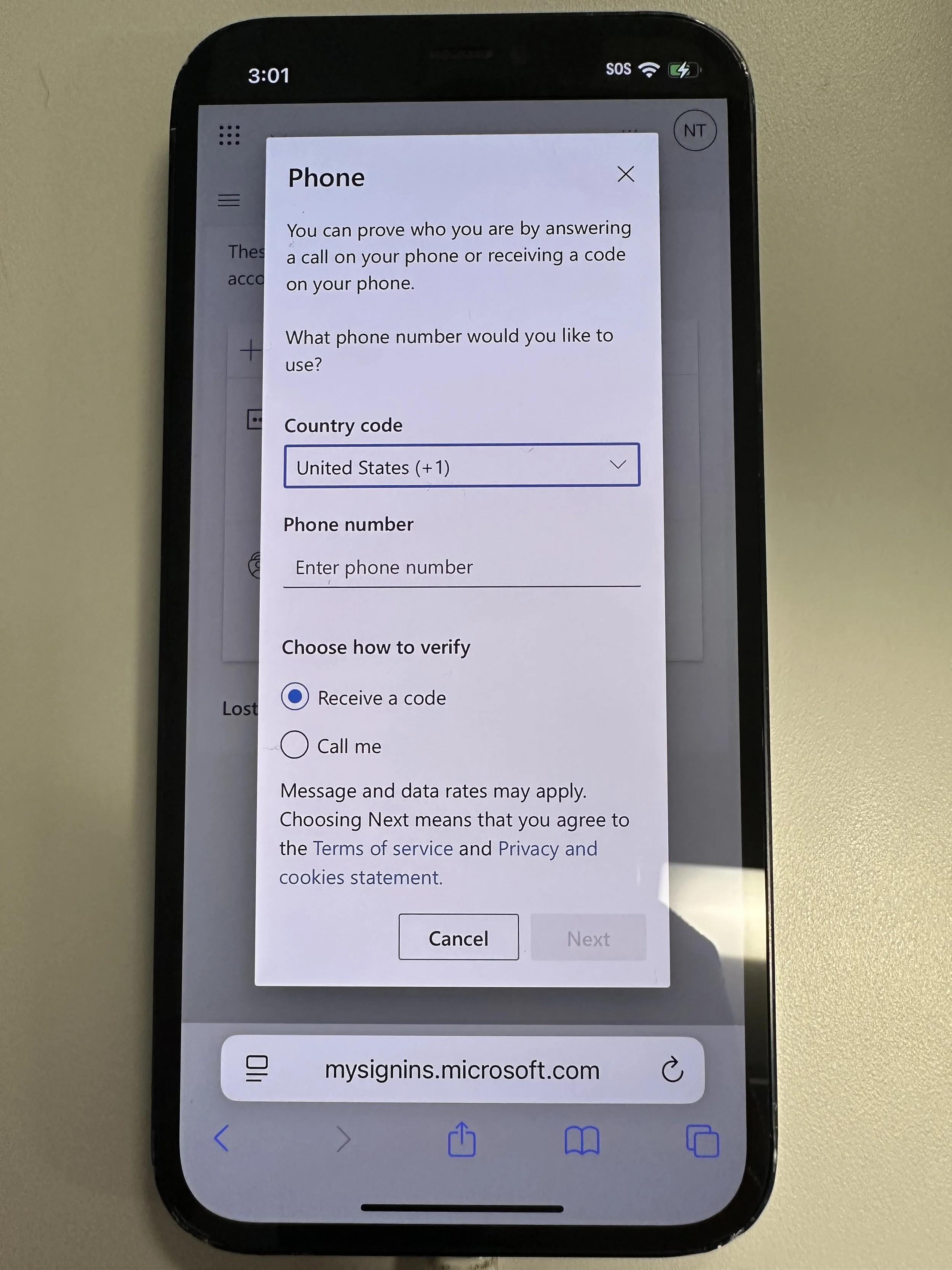  enter phone number. If using a non-US number, change the country code. Specify text or call. Tap Next 