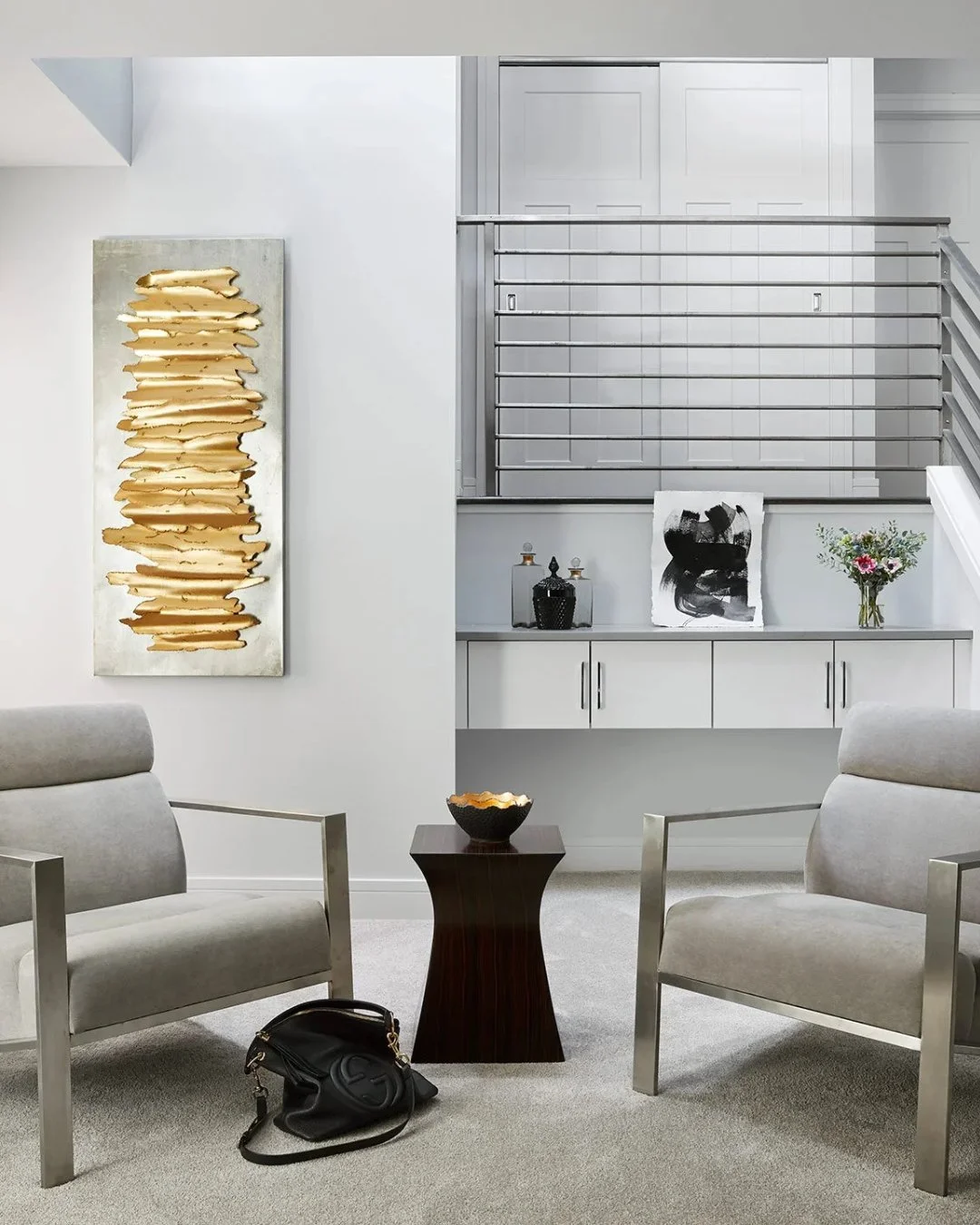 Chicago luxury, but make it intimate. 

Sculptural furniture, deep textures, and a palette that whispers elegance&mdash;this living room was designed to feel like a private escape above the city. Where every detail holds its breath&hellip; and nothin