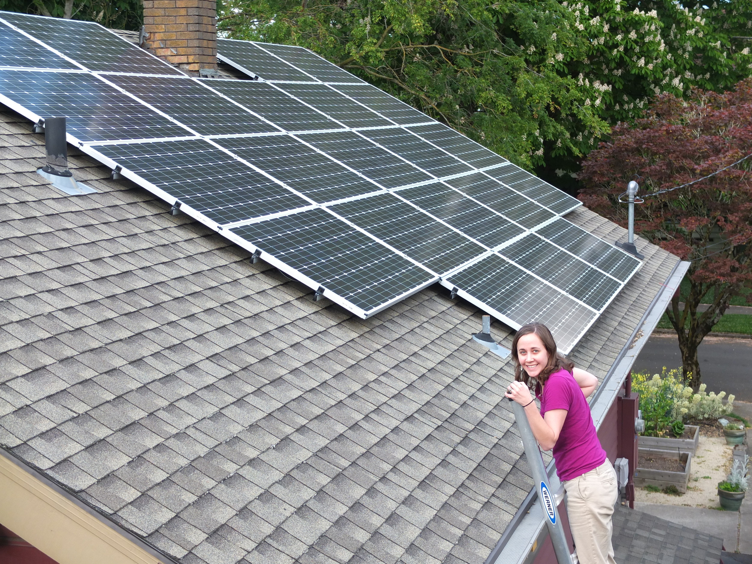 The solar panel installation powers the house and cedar hot tub.