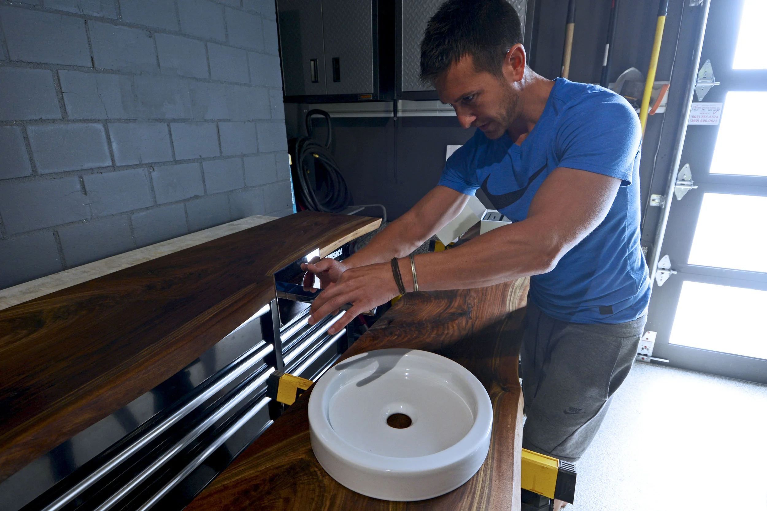 Chris shows final details for the master bath, which has just been installed.