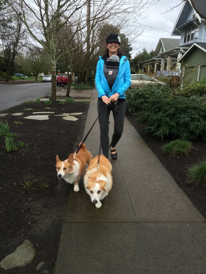 Neighbor Adrian Brown takes newborn son Miles for his first walk, escorted by their corgis, Sully (named for the Gulch) and Fiona.