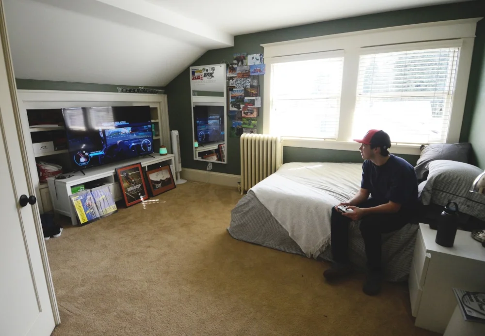 Henry relaxes at home, playing a videogame he likes because it sharpens reflexes when he’s driving.