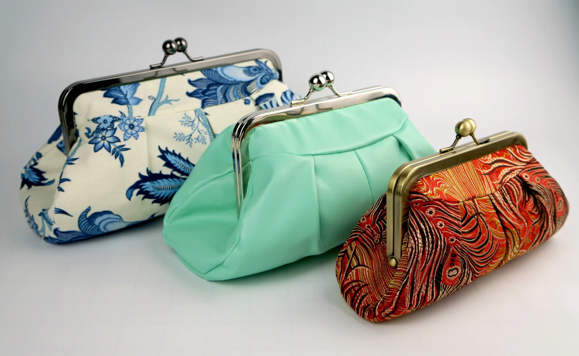 Flourish three clutches.jpg