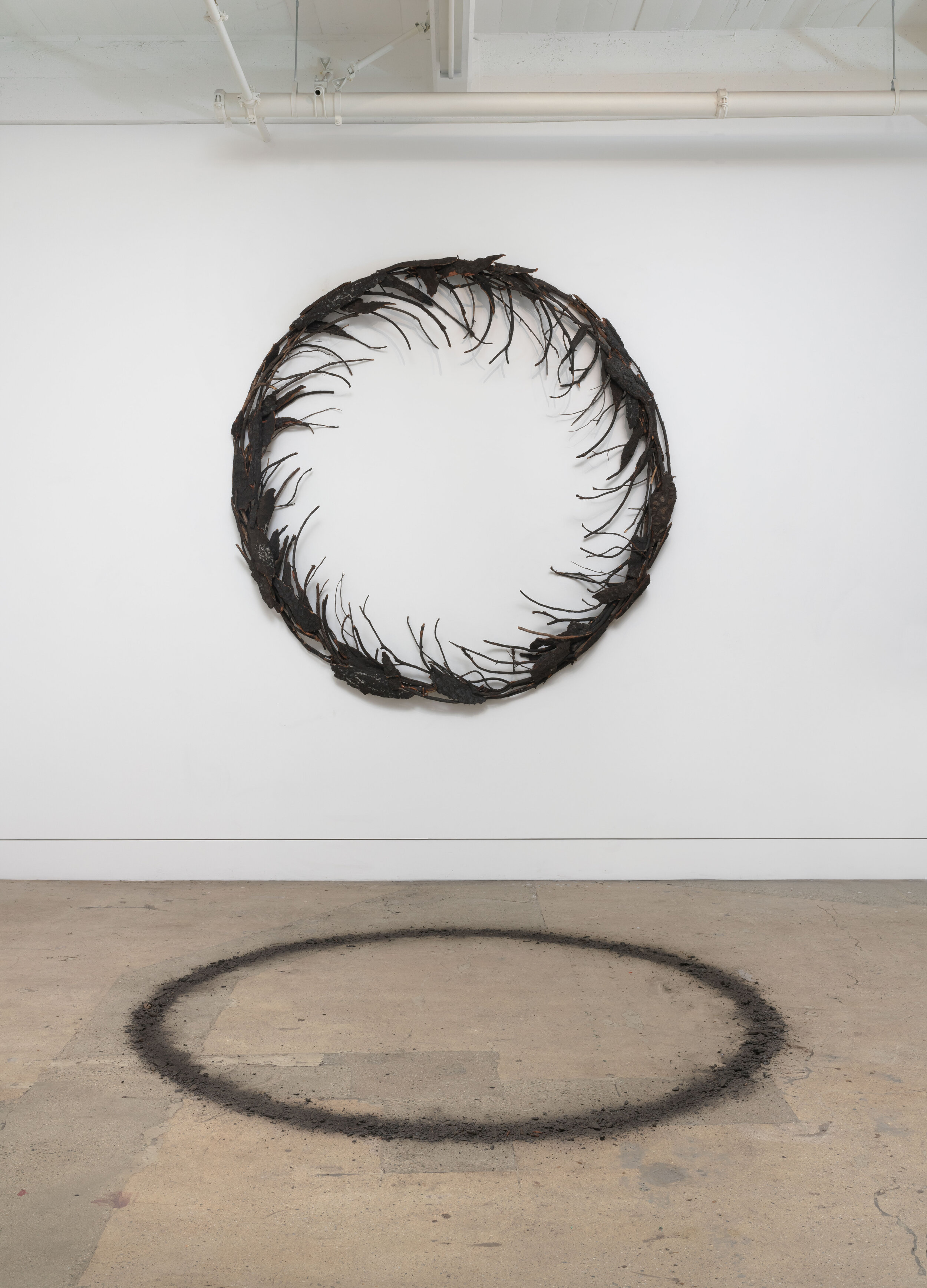  Shasta Wreath, 2020, organic materials obtained in collaboration with a Bureau of Land Management Forester, 100 inches diameter, wreath, 100 inches diameter, ash circle 