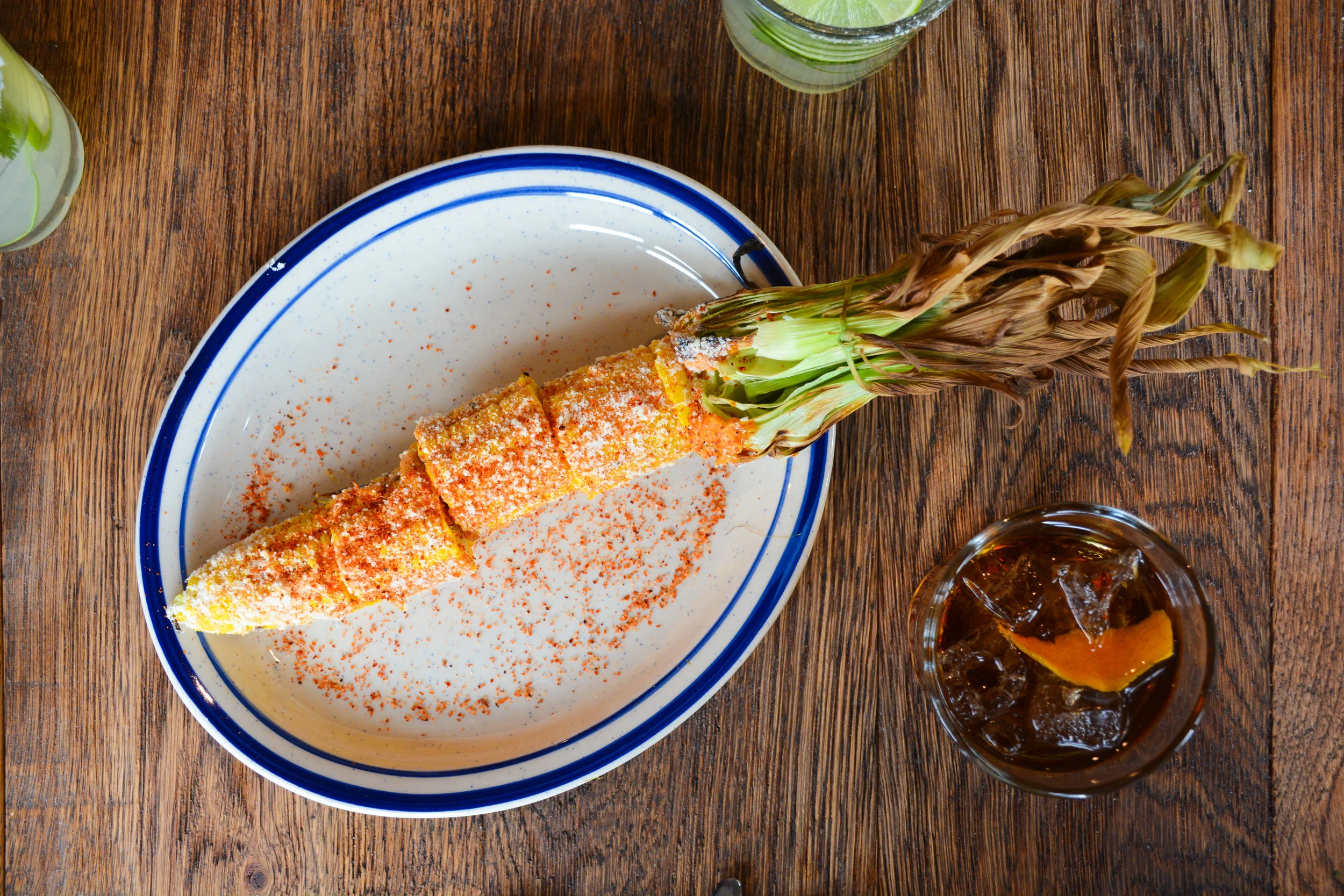 Elote Loco from La Puerta Verde - corn on the cob with spicy citrus mayo, chili & cojita cheese 