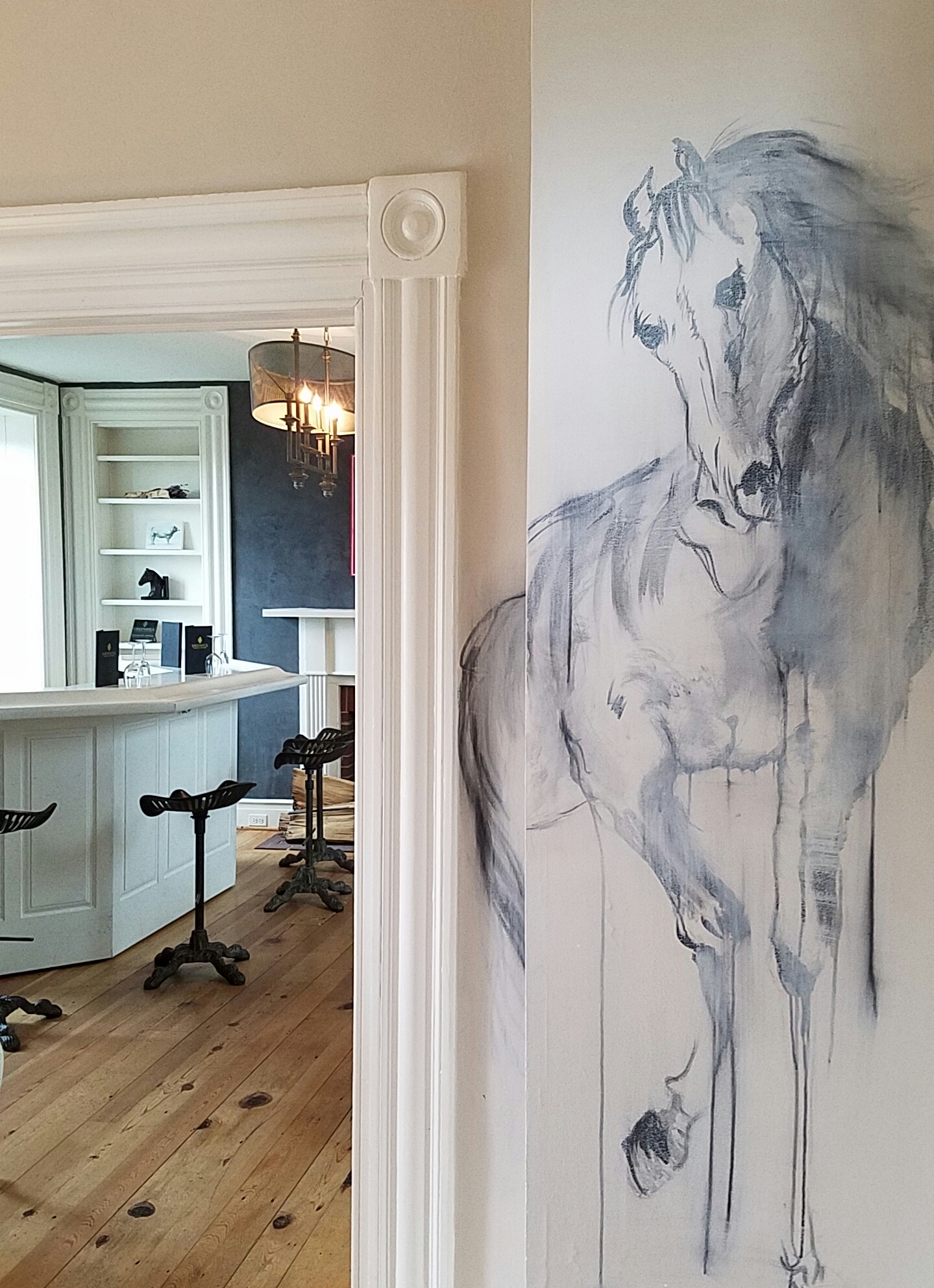The Manor House tasting room for Wine Club members at Greenhill Winery. The artwork is by artist Isabelle Truchon, www.isabelletruchonart.com