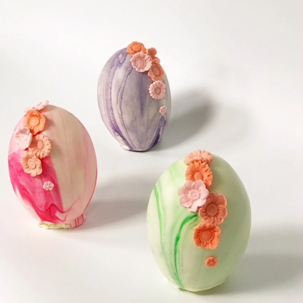 Devils Food Cake Eggs filled with creme, covered in white chocolate and finished with icing flowers. $18 at Buttercream Bakeshop. 