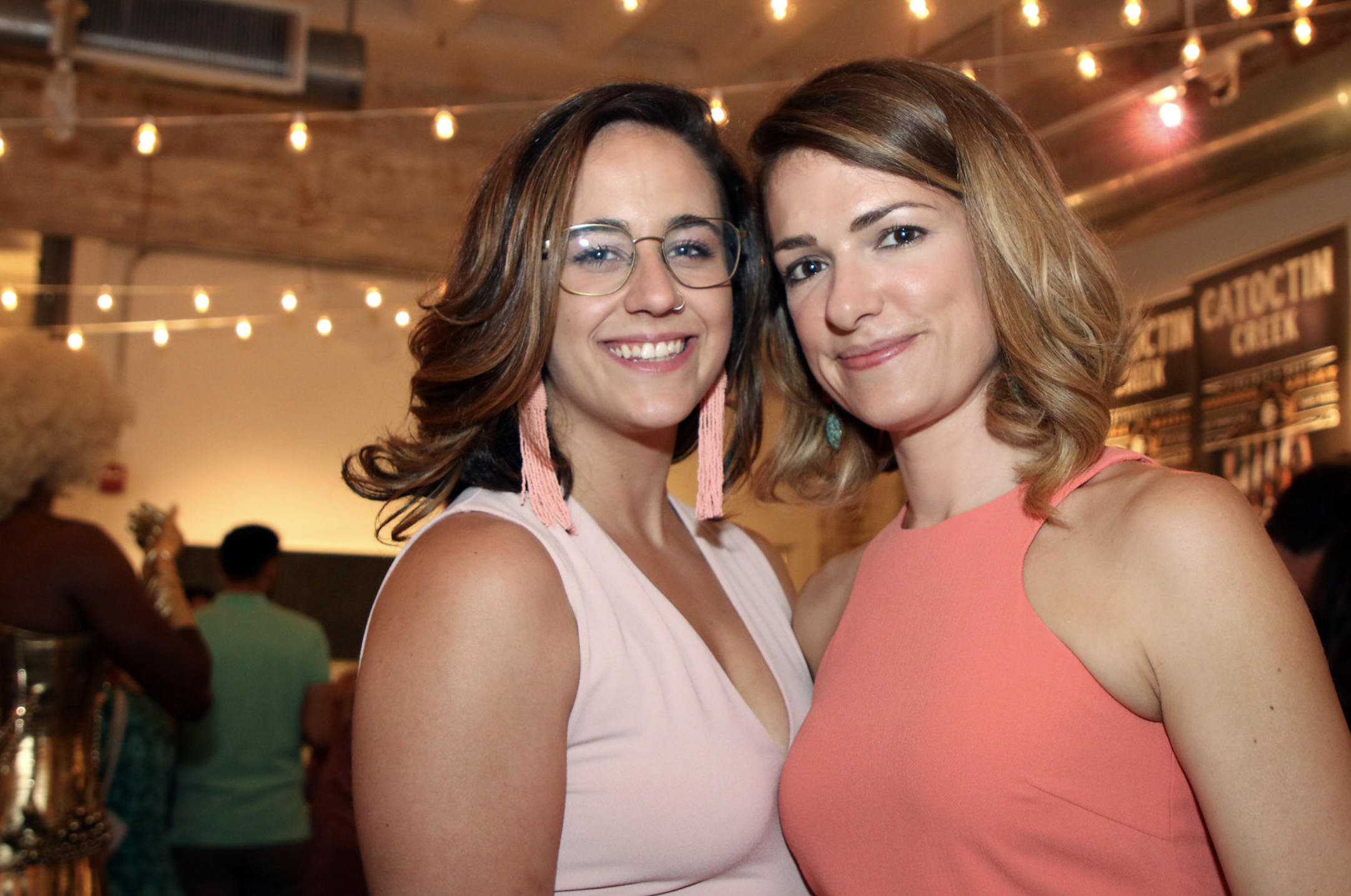 Carlie Steiner of Himitsu and guest enjoying the "District of Color" event. 