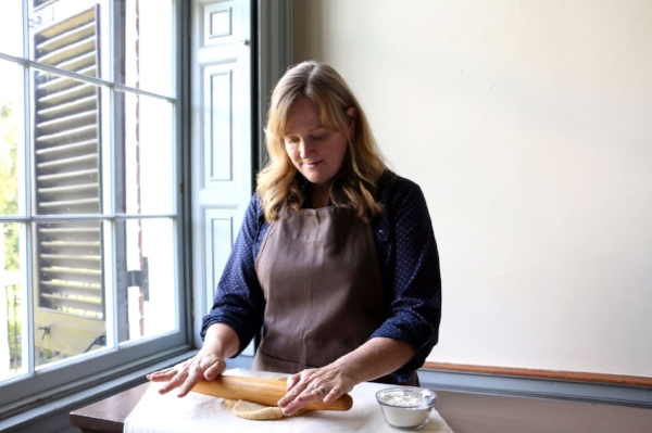 Lutz carefully rolls out her pastry dough.