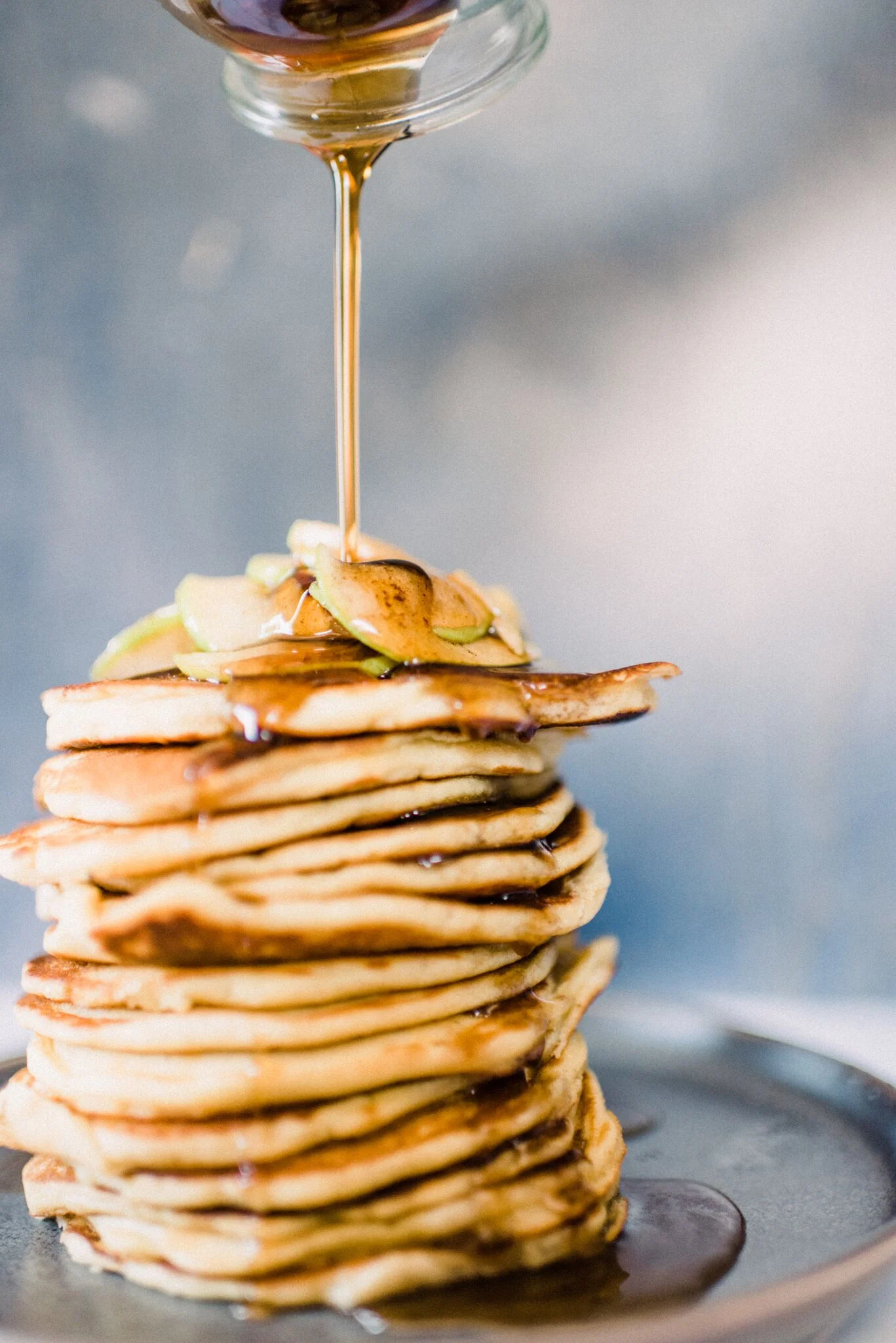 Maple syrup or honey pair perfectly with these apple pancakes.