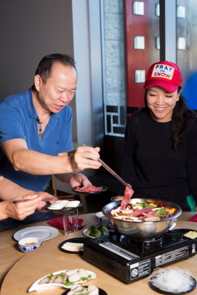 Peter, the Changs’ resident carnivore, adds meat to the hot pot.