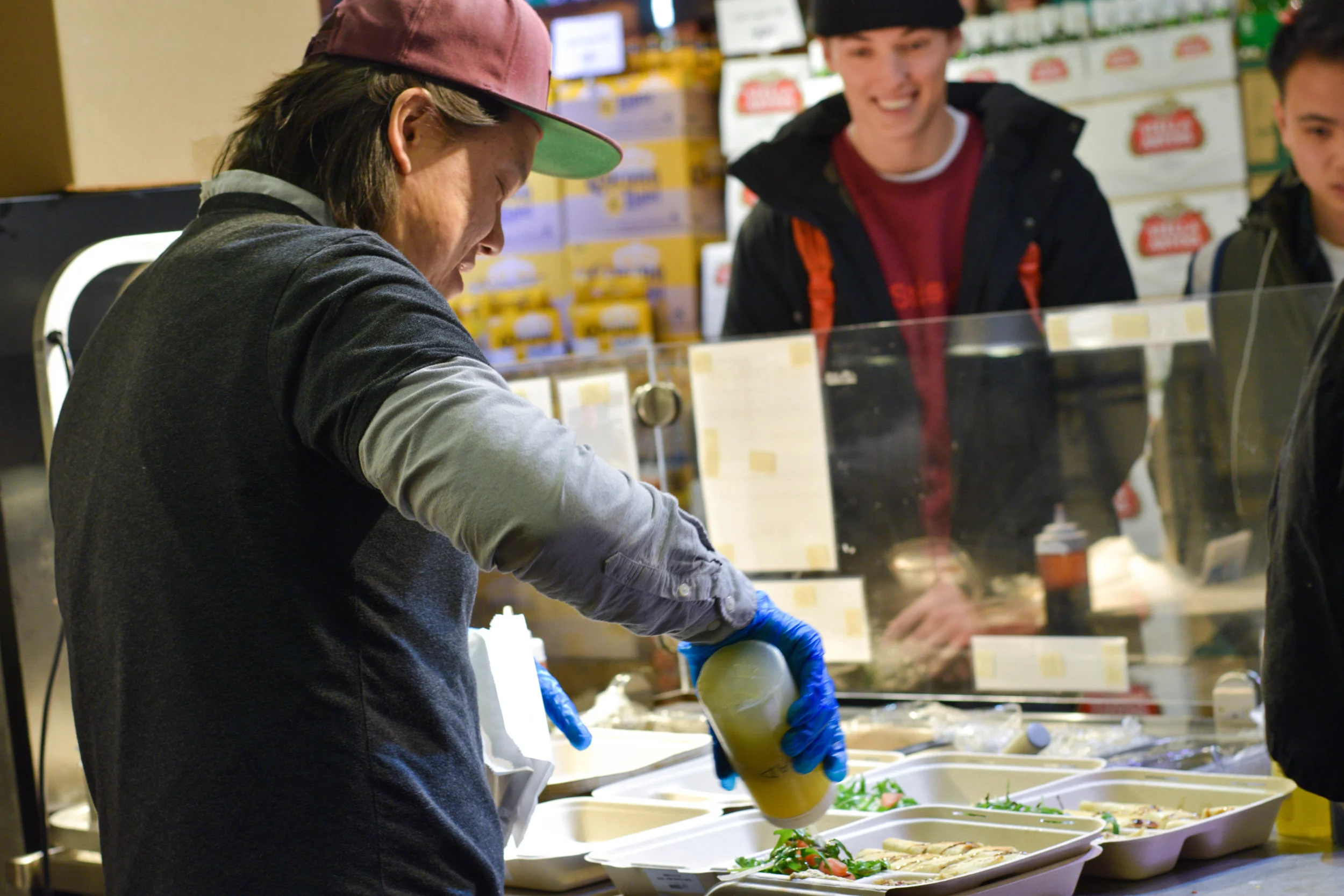 Noobtsaa Philip Vang prepares take out lunches at Foodhini’s new dedicated takeout counter at Whole Foods Foggy Bottom.