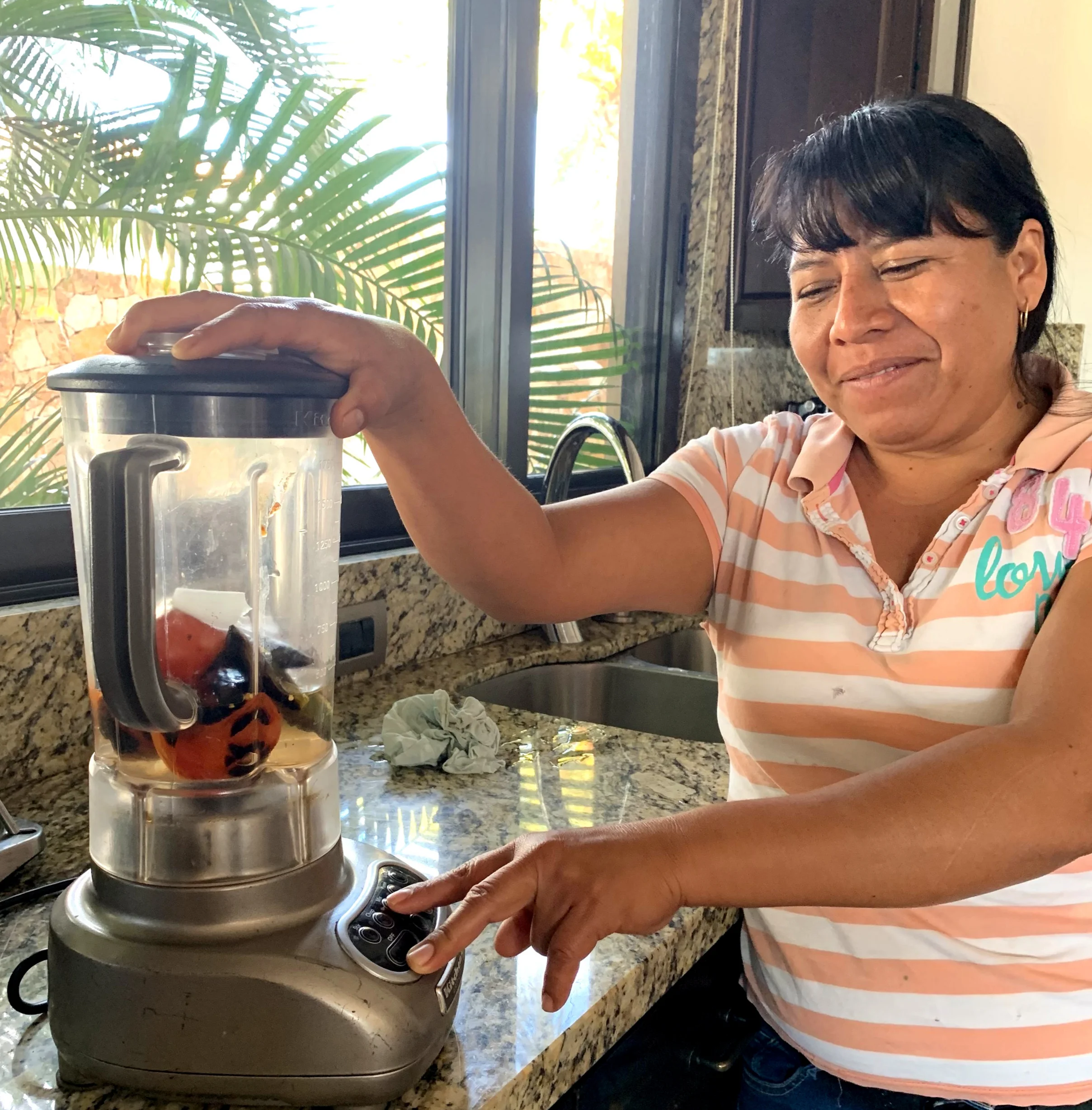 Note the level of water as Hilaria gets ready to blend.