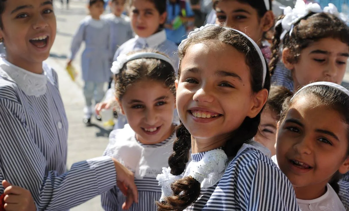 UNRWA Declares School Year Open Statement by UNRWA Commissioner-General Pierre Krähenbühl on the 2015/16 school year East Jerusalem I am pleased to declare the 2015/16 UNRWA school year open. Students will return to school according to plan in Palestine on 24 August, in Jordan on 1 September, in Lebanon on 7 September and in Syria on 13 September. I have taken this decision first and foremost because of how central education is to the identity and dignity of Palestine refugees and of the 500,000 boys and girls whose future depends on learning and developing skills in our 685 schools. It is on the benches and behind the desks of UNRWA classrooms that millions of Palestine refugees, deprived for so long of a just and lasting solution, have built the capabilities and shaped the determination that enabled them to become actors of their own destinies. Education is a fundamental right for children everywhere in the world, and it should never have come to the point where the UNRWA school year risked being delayed because of a funding shortfall for our core budget. But it almost did. For this reason we fought very hard to create a revival of solidarity for Palestine refugees and a renewed understanding of the importance of respecting their rights and addressing their needs adequately and predictably. For months UNRWA has been drawing the attention of the international community to the risks of neglecting the fate and plight of Palestine refugees in an increasingly unstable Middle East. Faced with the multiplicity of crises in the region, many were on the verge of purely and simply overlooking or forgetting the humiliation and despair endured for decades by Palestine refugees. UNRWA has insisted time and time again that this is a risk the world cannot take. We also heard the serious concerns expressed by host countries and the refugee community. The peaceful protests that took place over the past weeks showed solidarity and reminded the world of the importance of the work of UNRWA. We also demonstrated strong resolve in these difficult weeks because we were not prepared to provide education services at a discount price. The UNRWA education programme is one of the best and most cost-efficient in the region. We insisted on guaranteeing students their rights, the full quality school year, and education staff their full salaries. For this, we needed to close the funding gap. We began by taking significant internal measures to reduce costs and then engaged our partners, including host countries, member states and other donors, to overcome this major funding crisis and risk to the education programme. Our engagement included an extraordinary session of the UNRWA Advisory Commission and a special report to the Secretary-General, which was circulated to the General Assembly. The reactions and response we witnessed were remarkable. I wish to pay the warmest of tributes to a number of key countries and players involved in supporting us at this very difficult time. We are deeply grateful to the governments of host countries for their active engagement in recent weeks. Particular recognition goes to the President and to the Prime Minister of the State of Palestine; to the Prime Minister and to the Deputy Prime Minister and Foreign Minister of the Hashemite Kingdom of Jordan; and to the Prime Minister of Lebanon. We thank them all for their trust, exemplary support and commitment. We express profound appreciation to the Kingdom of Saudi Arabia, the State of Kuwait and the United Arab Emirates – whose remarkable combined contributions cover almost half of the 2015 deficit – and to the United States of America, Switzerland, the United Kingdom, Norway, Sweden and the Slovak Republic, who have together contributed generously to help address the funding shortfall. The total amount of contributions received to date against the deficit of US$ 101 million is US$ 78.9 million (see details below). In addition to this, we welcome the efforts by the European Union to mobilize additional means in a few weeks’ time and look forward to a positive decision. We note that two other countries are still seriously considering making their own donations. . While some significant work therefore remains, I consider that we have achieved our first objective and can open the schools. We are deeply pleased by the outcome of our efforts and the combined efforts of many partners and supporters. We extend a special message of sincere gratitude to the United Nations Secretary-General and the Deputy Secretary-General for their strong support and personal engagement. We are also very appreciative of the support of the Special Coordinator for the Middle East Peace Process and of the Under-Secretaries-General for Political Affairs and Humanitarian Affairs. At the same time, we are in pursuit of the second crucial objective and that is to place UNRWA on a more stable financial footing for the future. UNRWA will work actively in the coming months to take further internal measures to that effect. We will also actively engage and seek the support of hosts, member states and other donors for our internal measures and to achieve the goal of better protecting our human development activities, in particular our health and education services. UNRWA will participate in a series of important meetings with its partners, for example at ministerial-level meetings in September of the League of Arab States and at the United Nations General Assembly, to identify concrete ways to improve our future financial stability. In our hearts, we knew that there would be no rest until the day when we could announce the opening of UNRWA schools for the 2015/16 academic year. This was a priority of the highest order for all of us in the Agency. Now we turn our energy and focus to ensure that we never again reach the stage where core UNRWA services are at risk. It is a matter of dignity and respect for Palestine refugees and their children. My determination and commitment in this regard and in protecting the mandate of UNRWA is absolute. Donations (US$): Kingdom of Saudi Arabia: 19 million (confirmed on 12 August) State of Kuwait: 15 million (confirmed on 17 August) United Arab Emirates: 15 million (confirmed on 18 August) United States of America: 15 million (confirmed on 18 August) Switzerland: 5.15 million (confirmed on 30 July) United Kingdom: 4.69 million (confirmed on 12 August) Norway: 2.44 million (confirmed on 6 August) Sweden: 1.7 million (confirmed on 19 August) Slovak Republic : 0.05 million (confirmed on 25 July) In addition (US$): Al-Khair Foundation: 0.72 million (confirmed on 20 July) Basque Government: 0.11 million (confirmed on 30 July) BACKGROUND INFORMATION UNRWA is funded almost entirely by voluntary contributions, and financial support has not kept pace with an increased demand for services caused by growing numbers of registered refugees, deepening poverty and conflict. As a result, the UNRWA General Fund, which supports core essential services and most staffing costs, operates with a large deficit. UNRWA emergency programmes and key projects, also operating with large deficits, are funded through separate funding portals. UNRWA is a United Nations agency established by the General Assembly in 1949 and mandated to provide assistance and protection to some 5 million registered Palestine refugees. Its mission is to help Palestine refugees in Jordan, Lebanon, Syria, West Bank and the Gaza Strip achieve their full human development potential, pending a just solution to their plight. UNRWA services encompass education, health care, relief and social services, camp infrastructure and improvement, and microfinance. For more information, please contact: Christopher Gunness Spokesperson, Director of Advocacy & Strategic Communications Mobile: +972 (0)54 240 2659 Office: +972 (0)2 589 0267 c.gunness@unrwa.org Sami Mshasha Chief of Communications, Arabic Language Spokesperson Mobile: +972 (0)54 216 8295 Office: +972 (0)2 589 0724 s.mshasha@unrwa.org