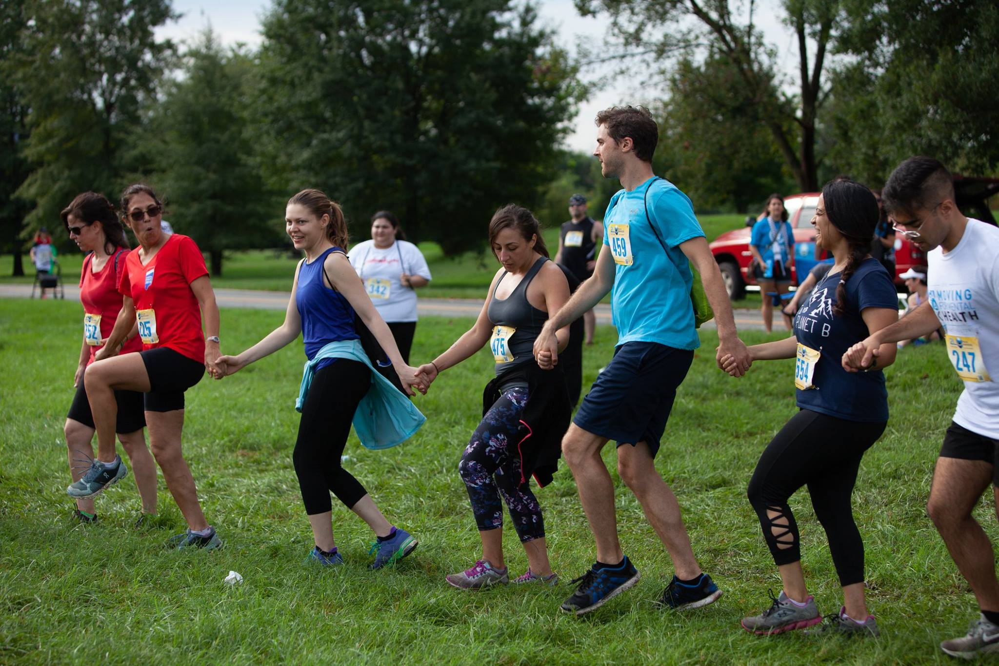 Lisa and Dominique (far left, in red) dance dabke alongside their fellow 5Kers