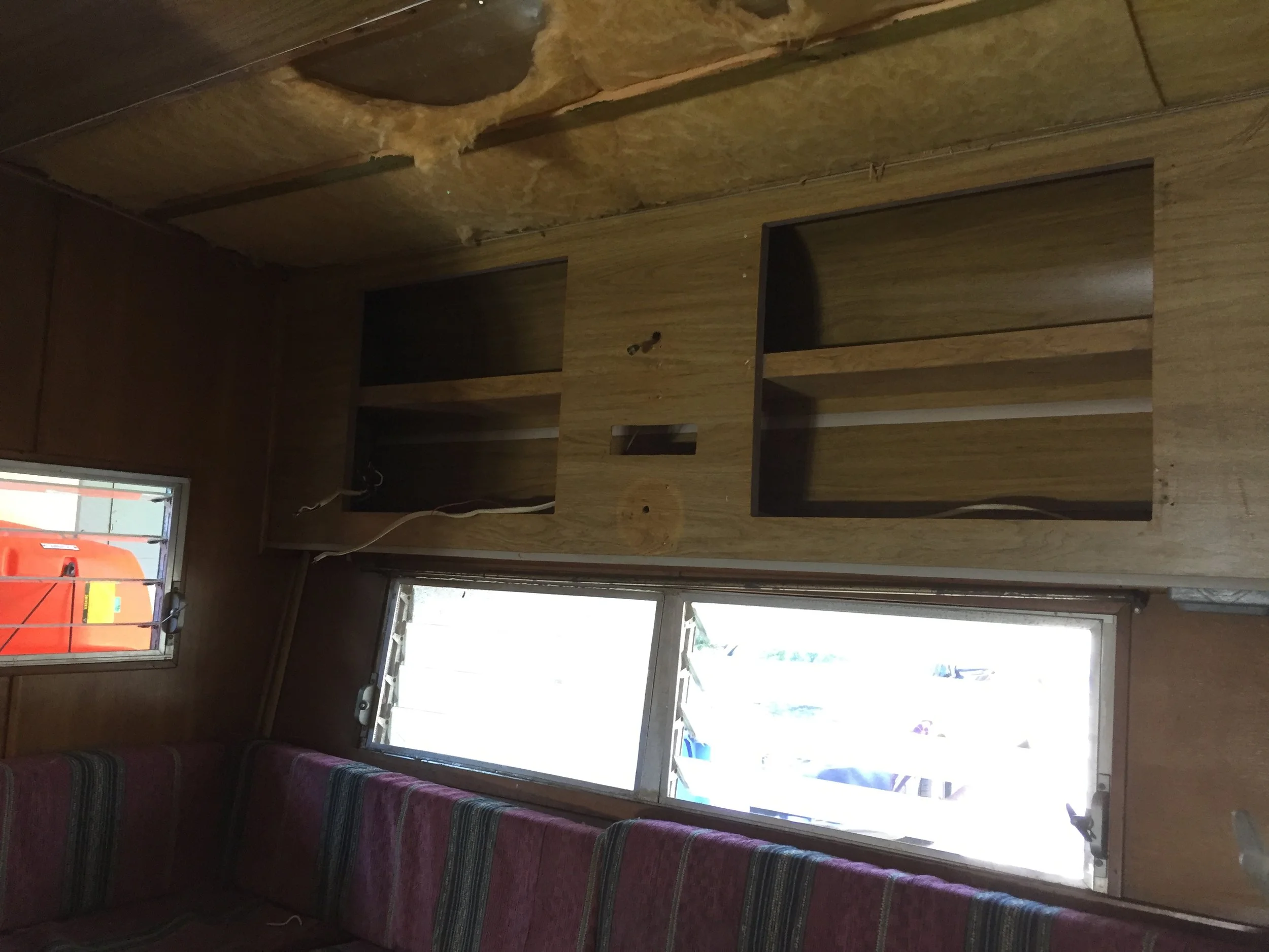 Cabinet above dinette area after the gas light, cabinet doors, car stereo and about 3 miles worth of electrical speaker cable for said stereo (that really only needed to span only about 3 feet of space) were carefully removed.