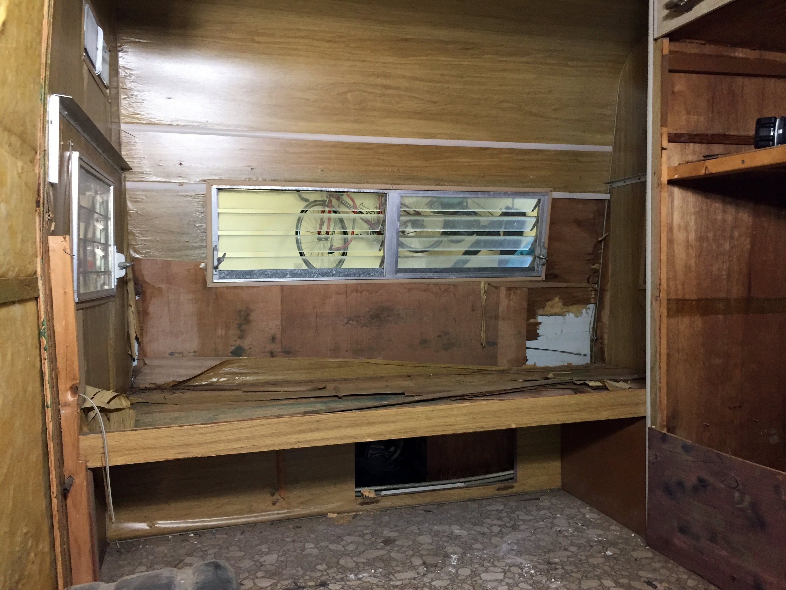 Couch/bed area in the rear of the camper — more layers than Shrek's donkey.