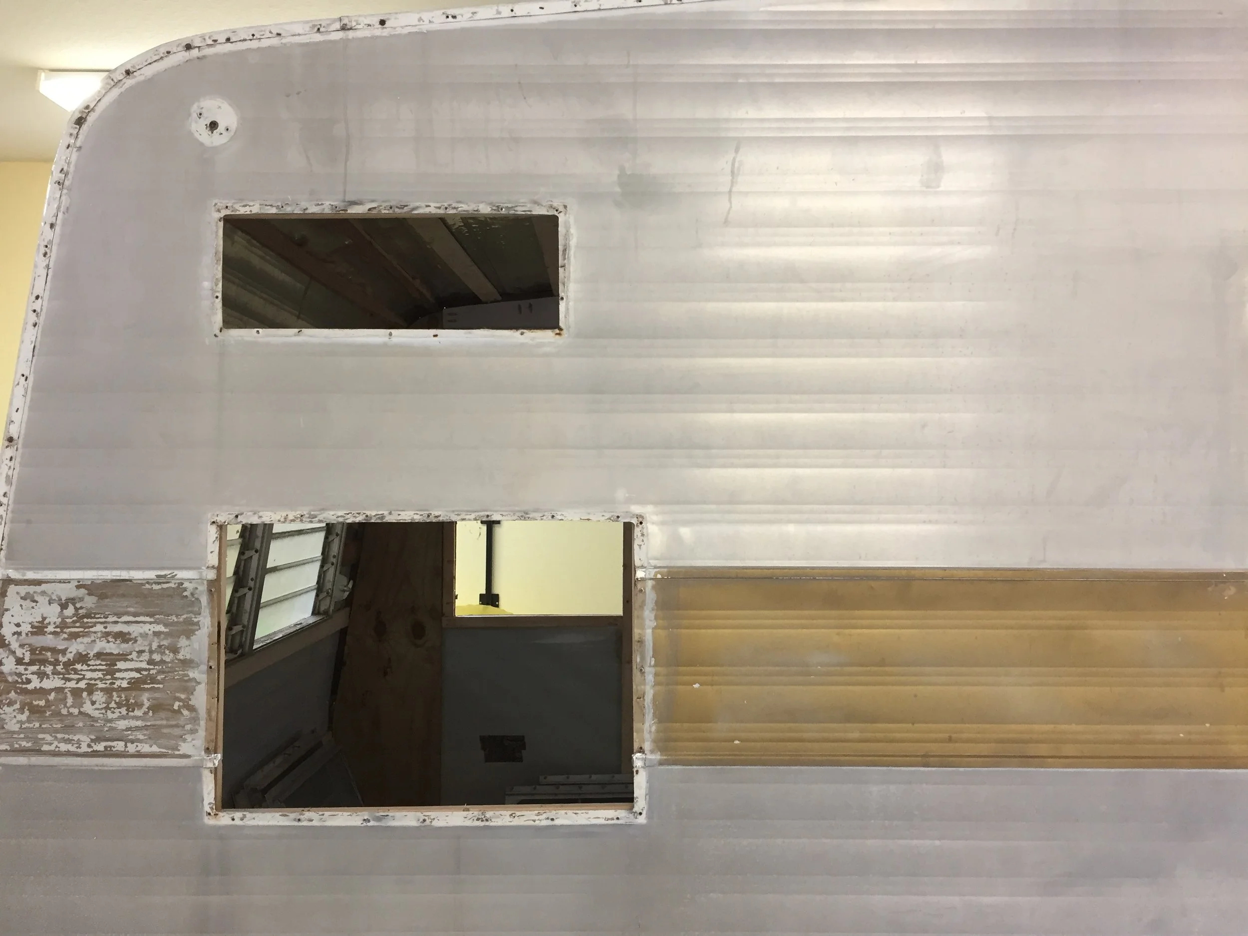Windows removed – we tried grinding and polishing the windows in place, but decided since we were removing them anyway to replace the putty tape, we’d polish them while they were out.