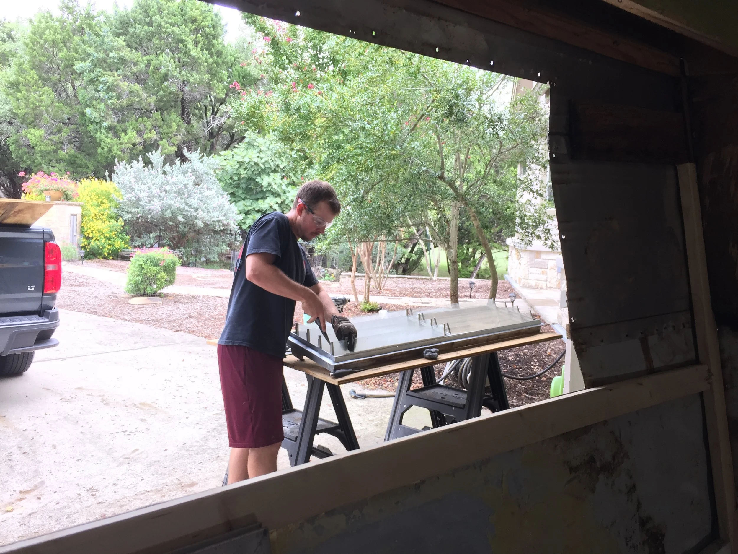 Nick replacing the jalousie glass retainer discs on the large front double window