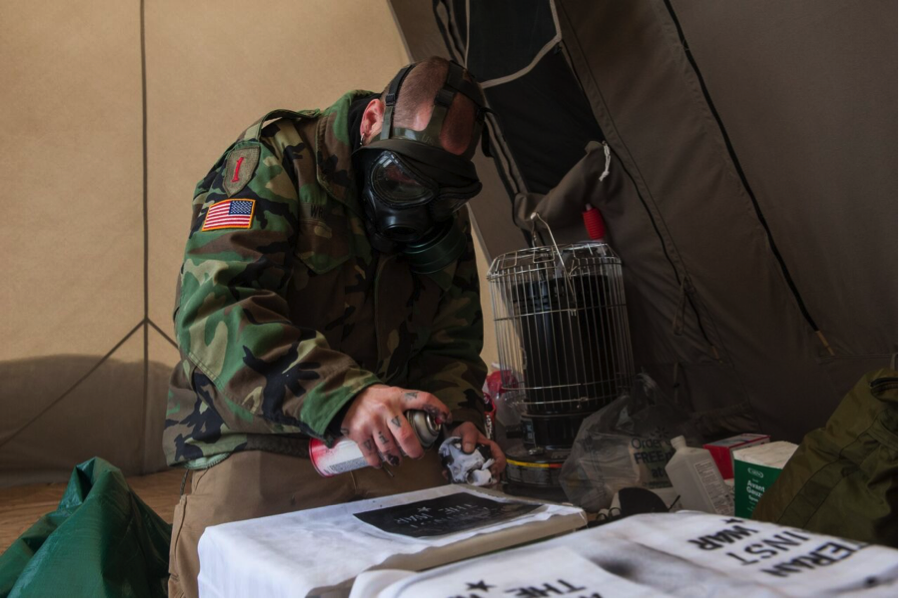  Eli Wright, making stencil patches at Standing Rock (Photo credit: Cole Howard)