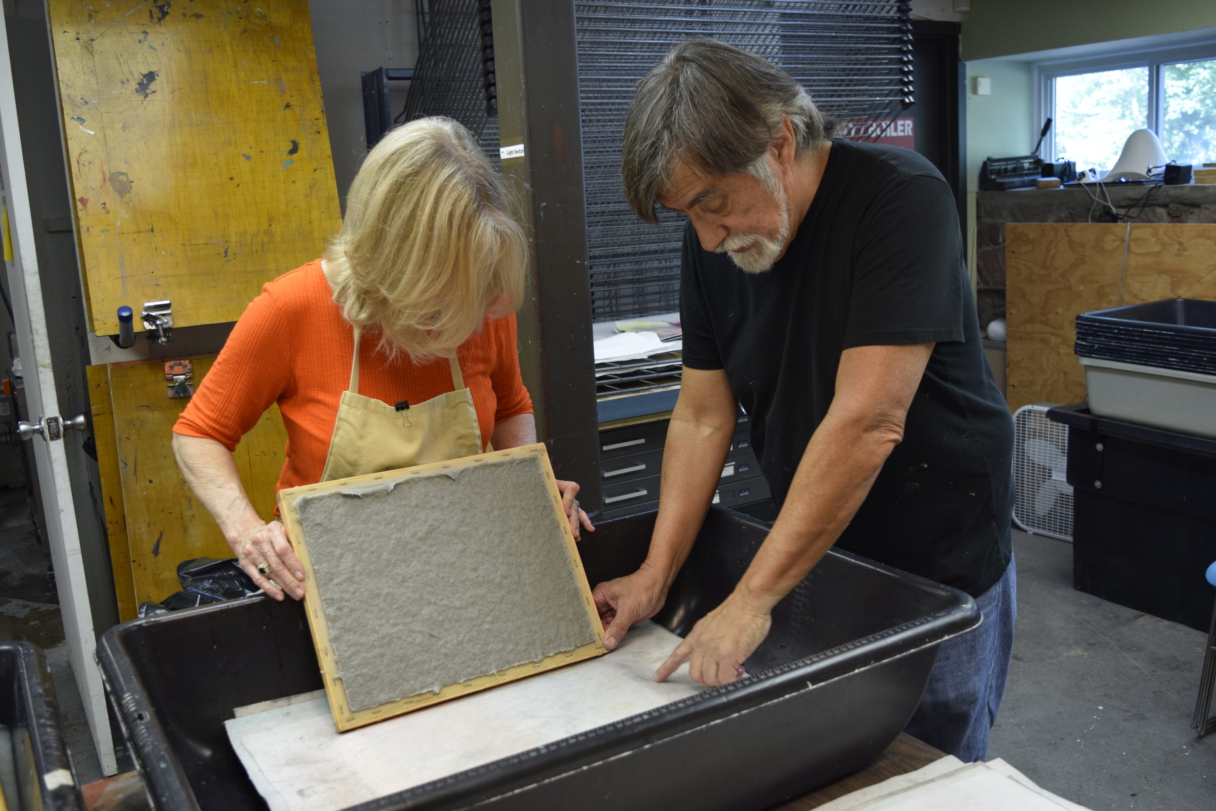  Walt Nygard teaching non-veterans how to make handmade paper from military uniforms 