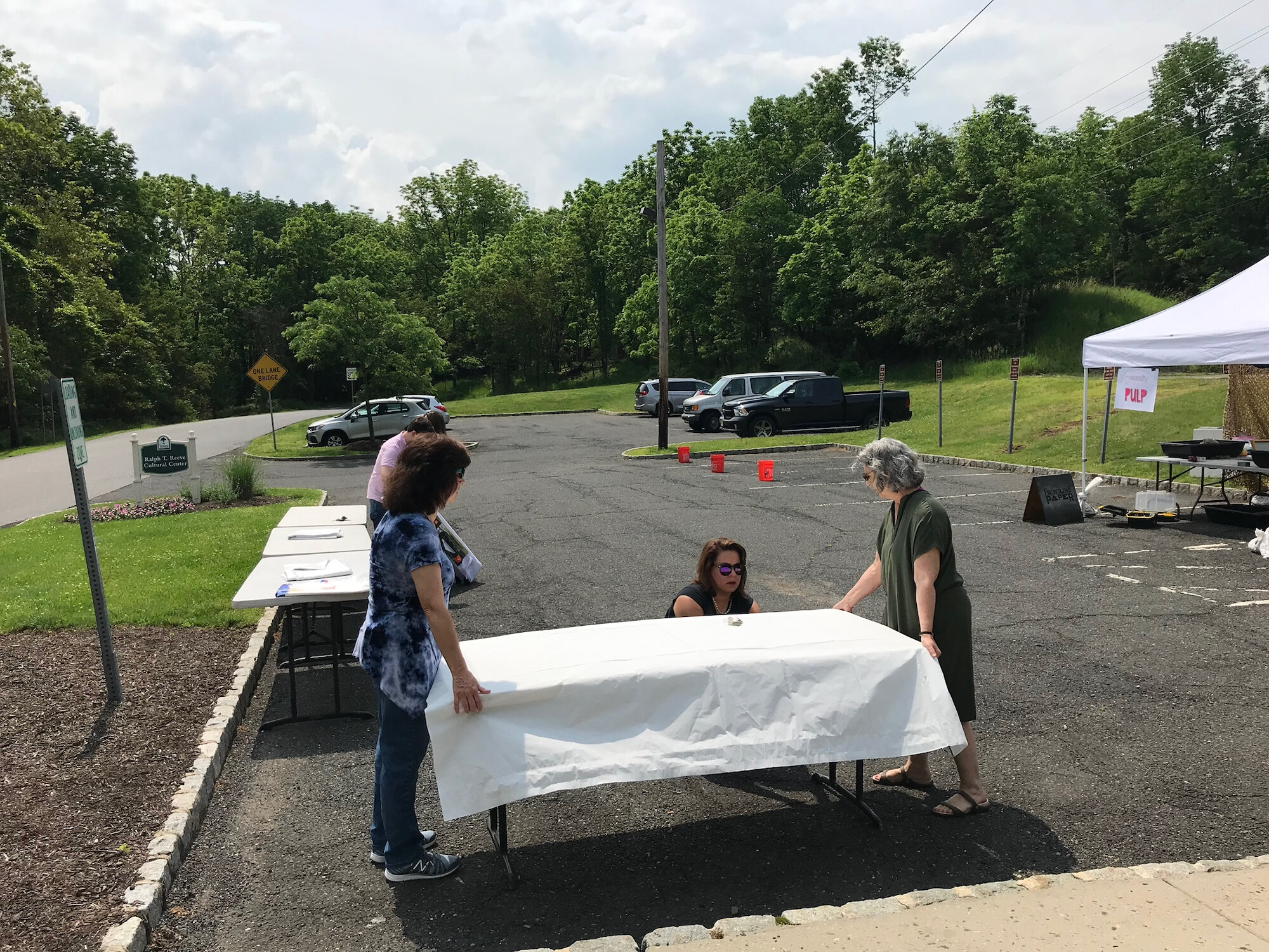setting up tables and tents in parking lot