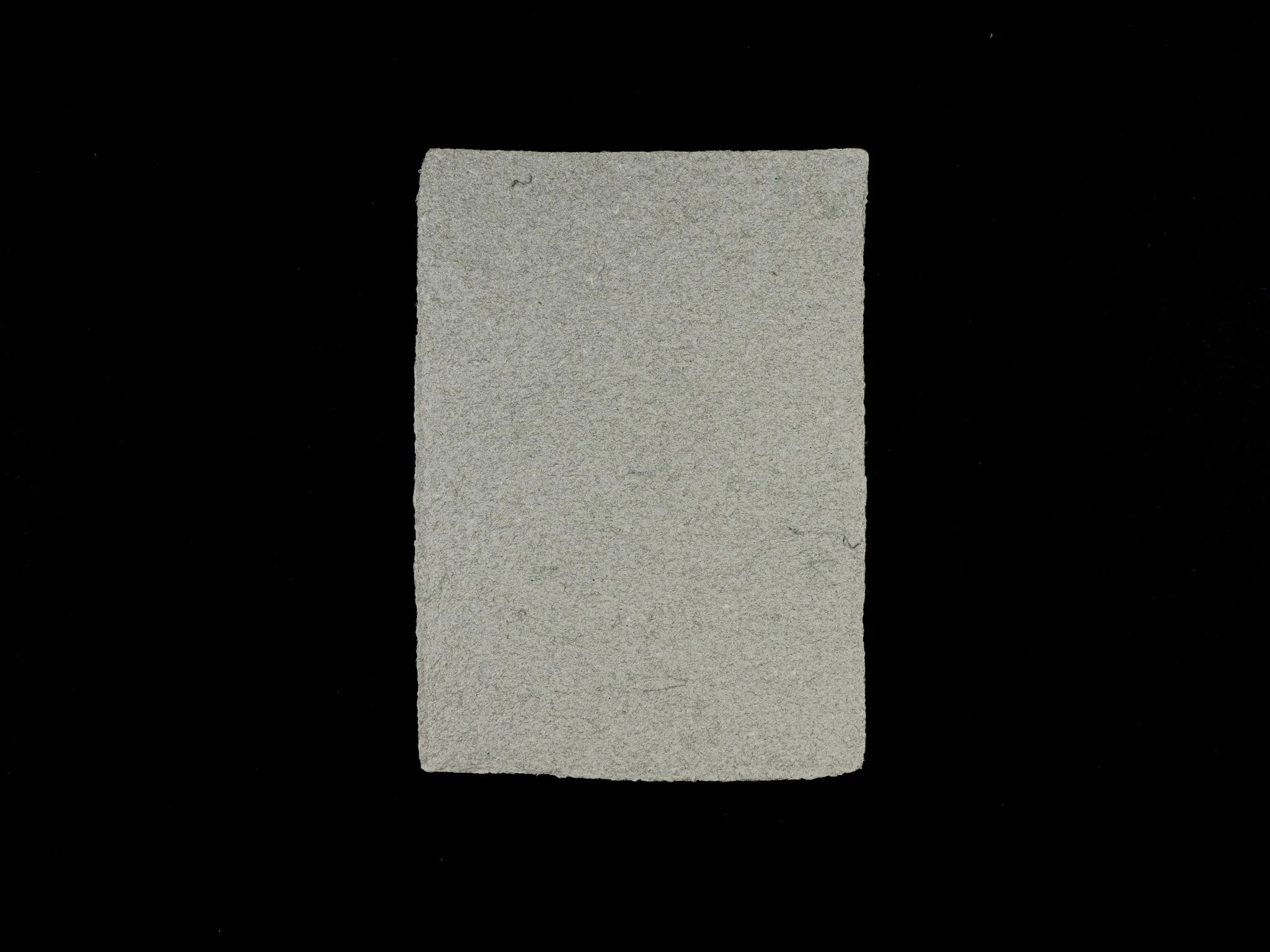 5 inch by 7 inch handmade paper made from a variety of military uniforms and World War 2 era wool.