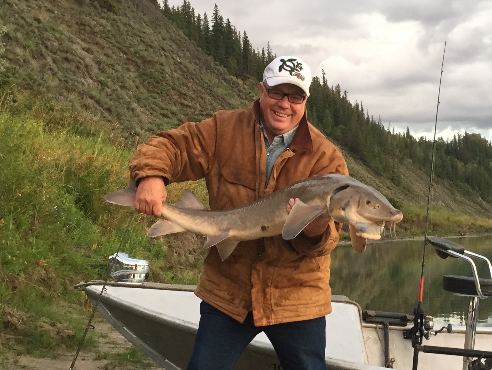 Wayne managed to catch a big sturgeon and a trophy jackfish over four feet all in one evening. Edmonton, Alberta, Canada.