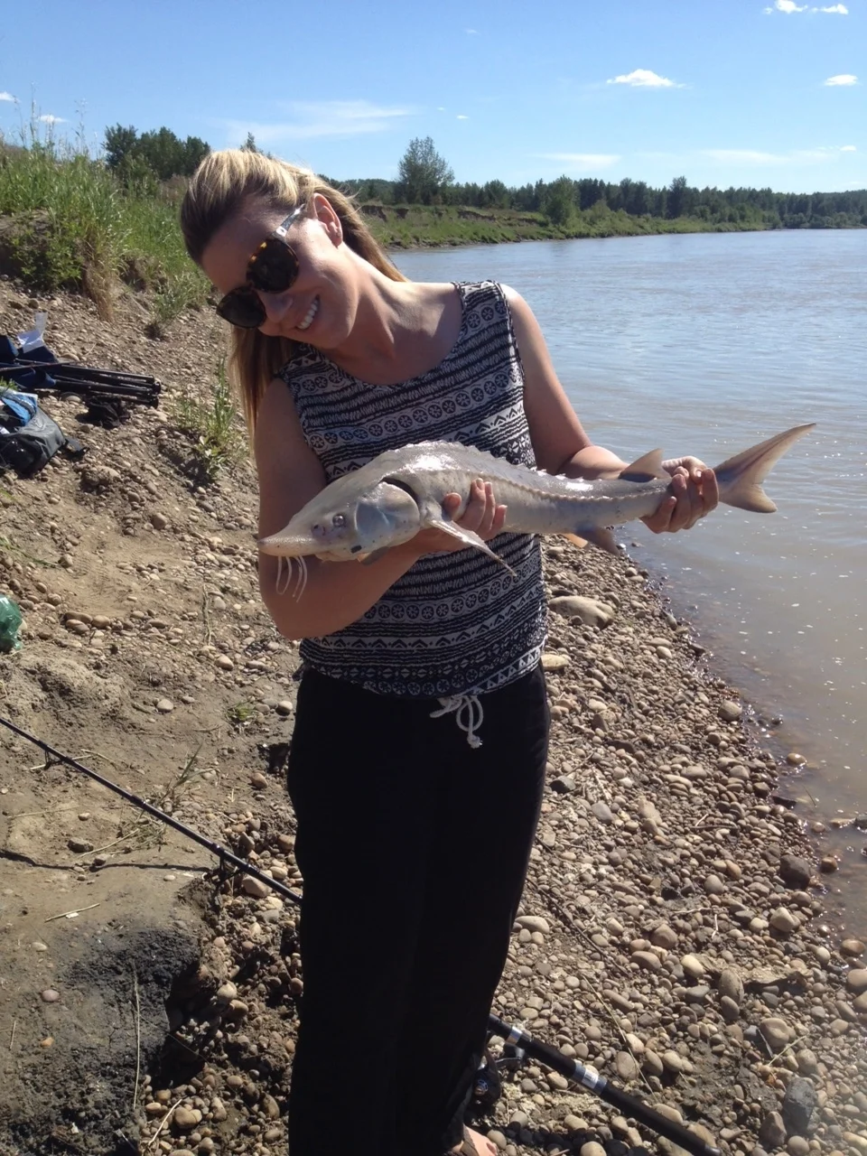 Heather and a young healthy sturgeon. These young sturgeon have very sharp scoots for protection of predators.